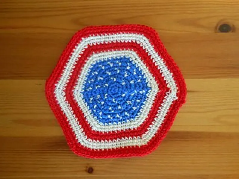 Delicate thread crochet coaster in red, white and blue