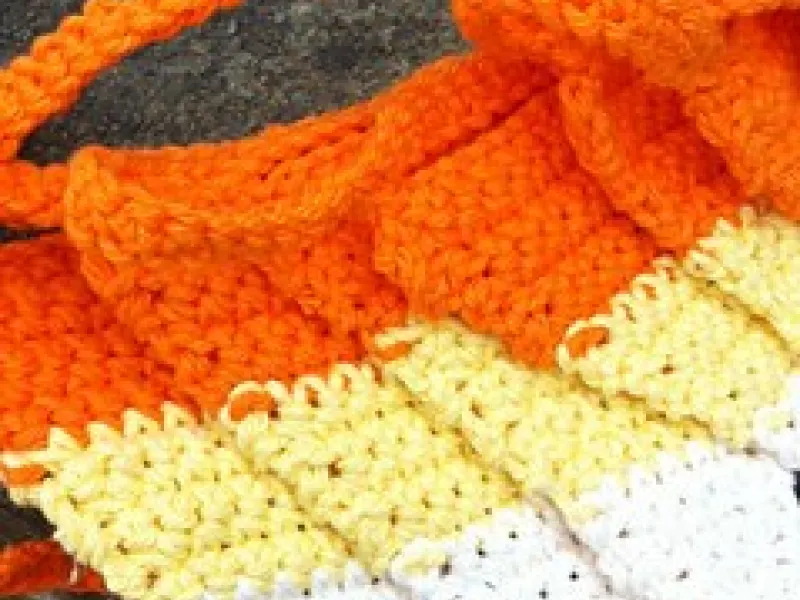 Candy corn crochet bunting hanging along a wall