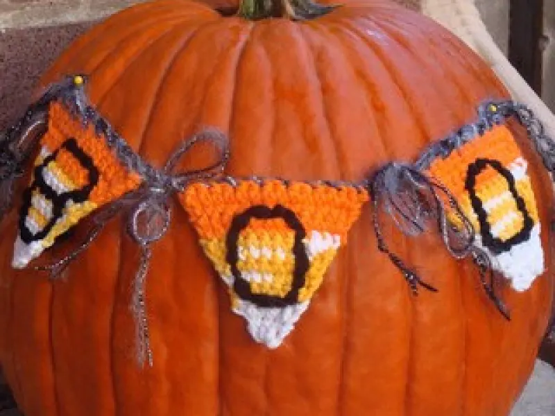 Crochet bunting flags spelling BOO in contrasting colors