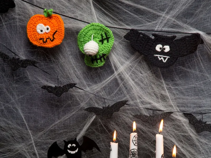 Crochet banner with Halloween creature flags in worsted yarn