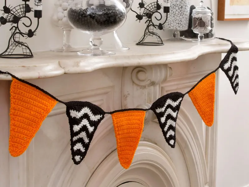 Crochet Halloween party banner with colorful themed flags