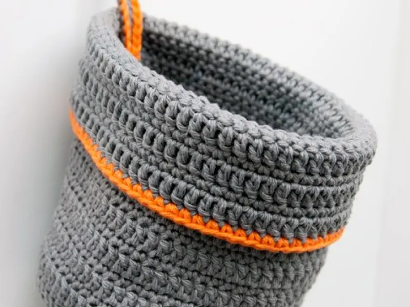 Crochet hanging organizer basket in a craft room